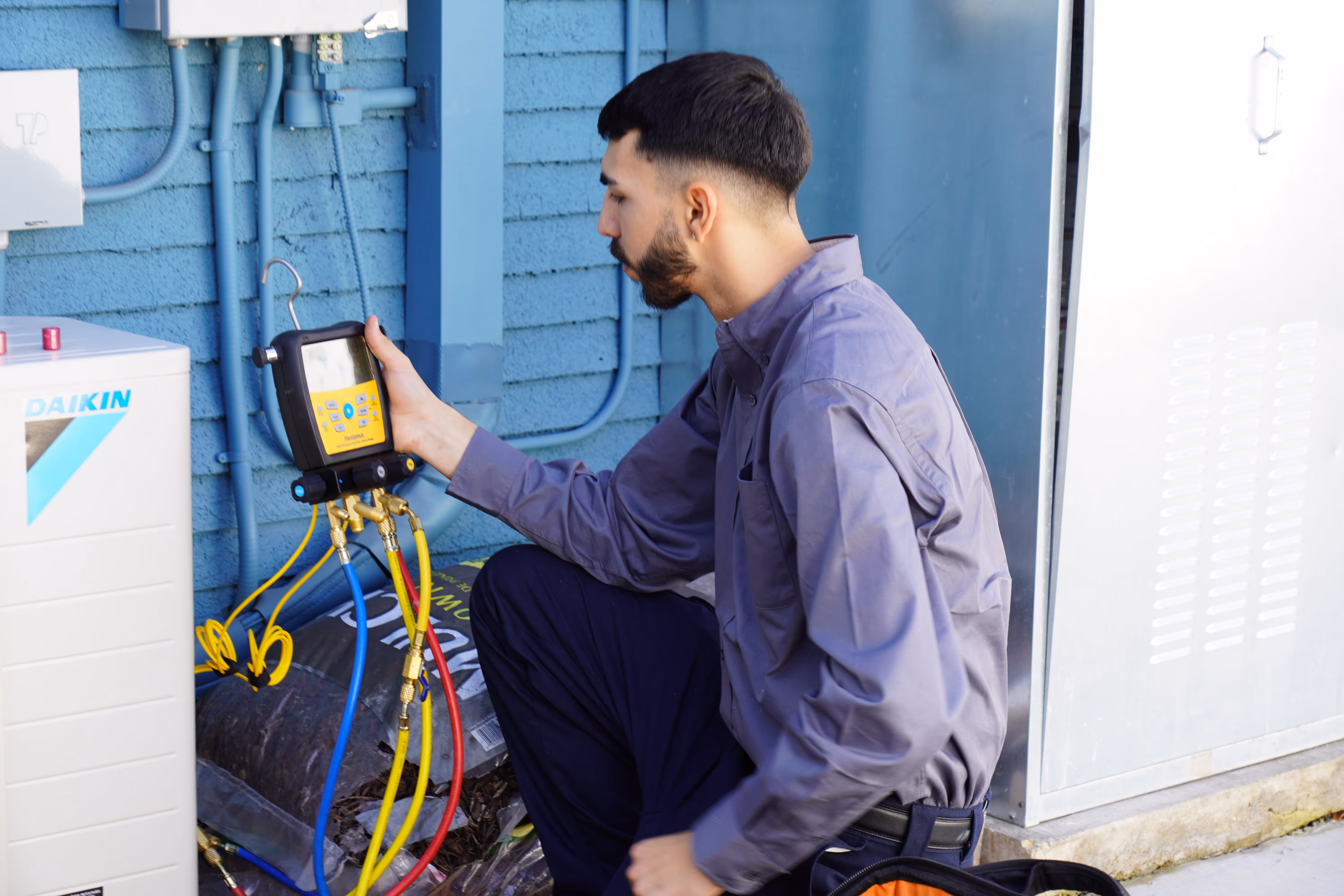 Cloud Comfort HVAC technician mid-install on a coastal California home